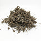 Pile of dried Bhringraj (Eclipta prostrata) herb for hair growth and Ayurvedic use