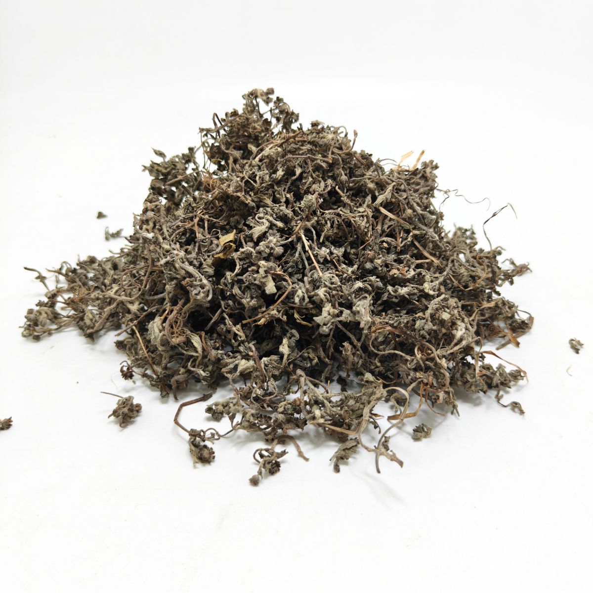 Pile of dried Bhringraj (Eclipta prostrata) herb for hair growth and Ayurvedic use